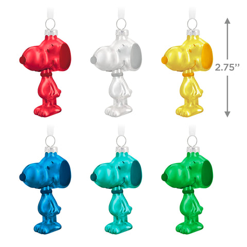 Hallmark Keepsake grouped Snoopy ornaments arranged on tabletop tree to create focal display
