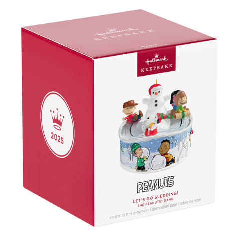 Hallmark Keepsake beside ruler for scale benefit: conveys compact ornament dimensions