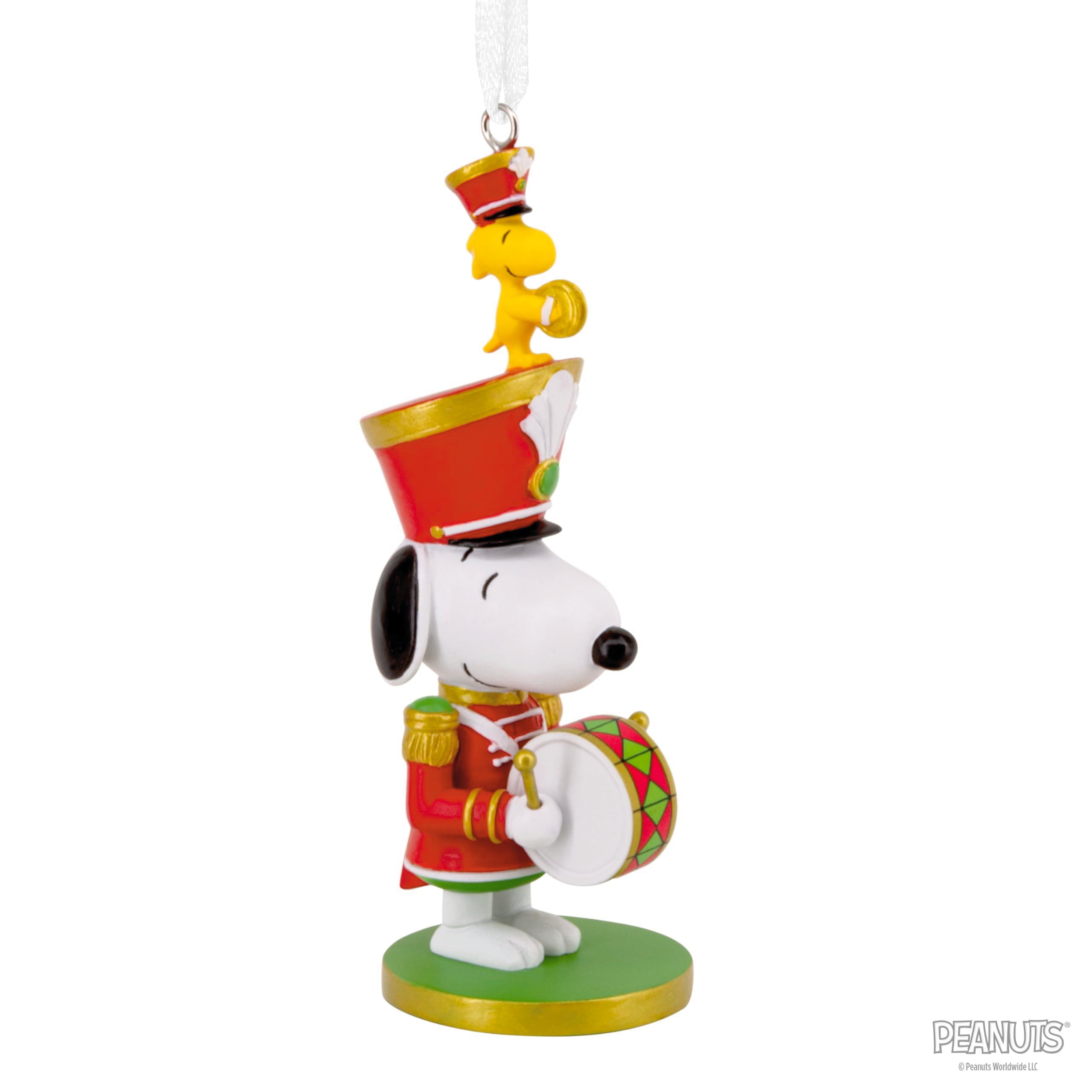 Hallmark Snoopy next to coin for size comparison showing compact scale