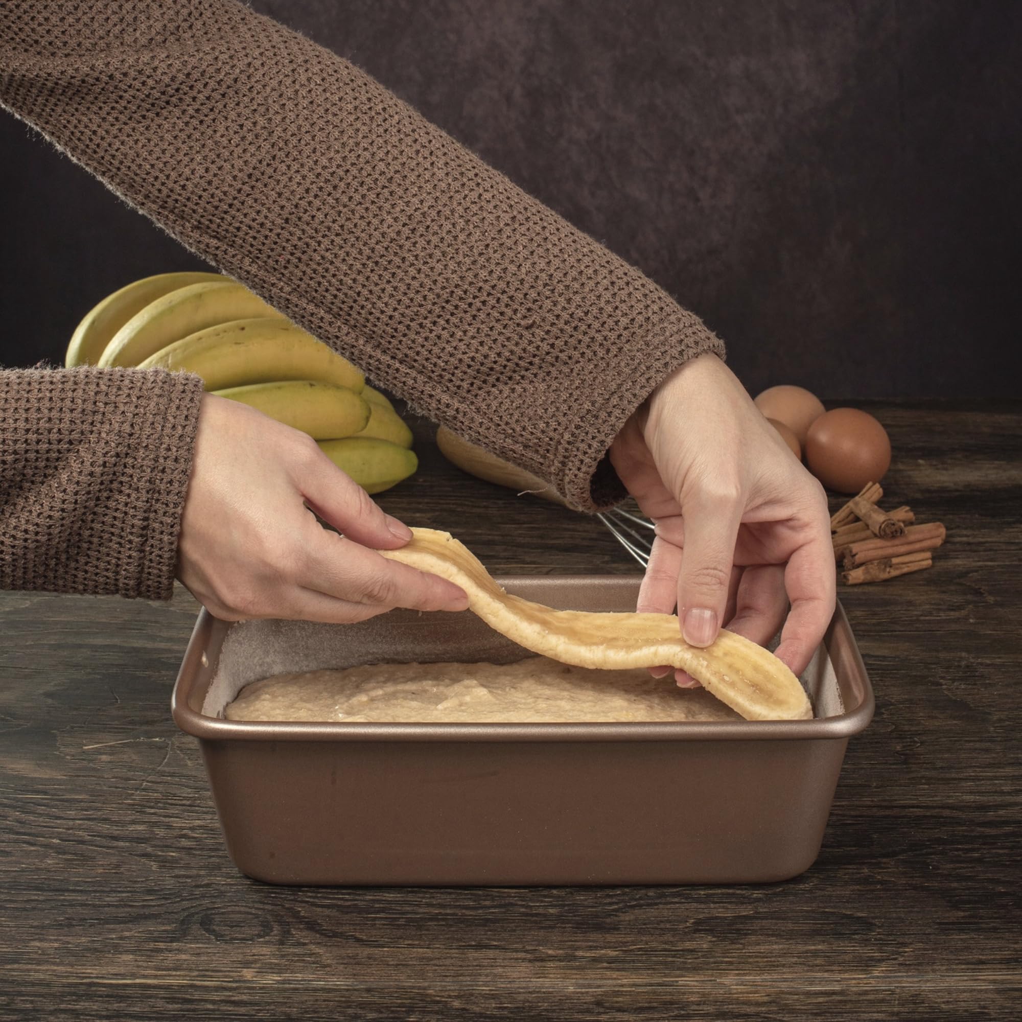 HAPPIELS loaf pan with sliced banana bread showing clean release and moist crumb