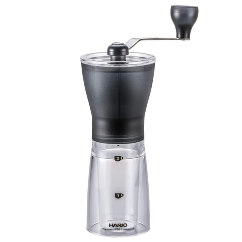 HARIO front view showing compact black grinder and clear bottle, saving counter space