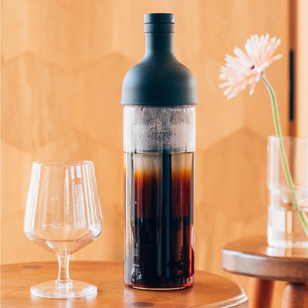 HARIO bottle on table with glasses showing elegant presentation and serving convenience benefit