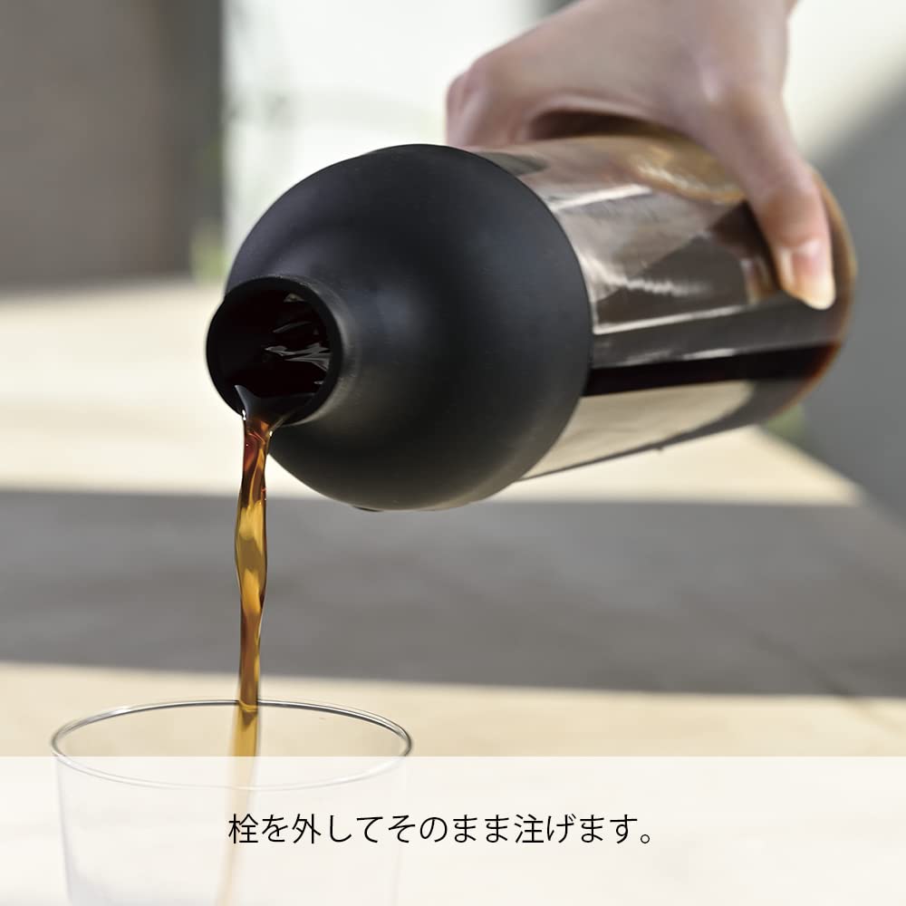 HARIO pouring cold brew from bottle demonstrating controlled pour and spill reduction