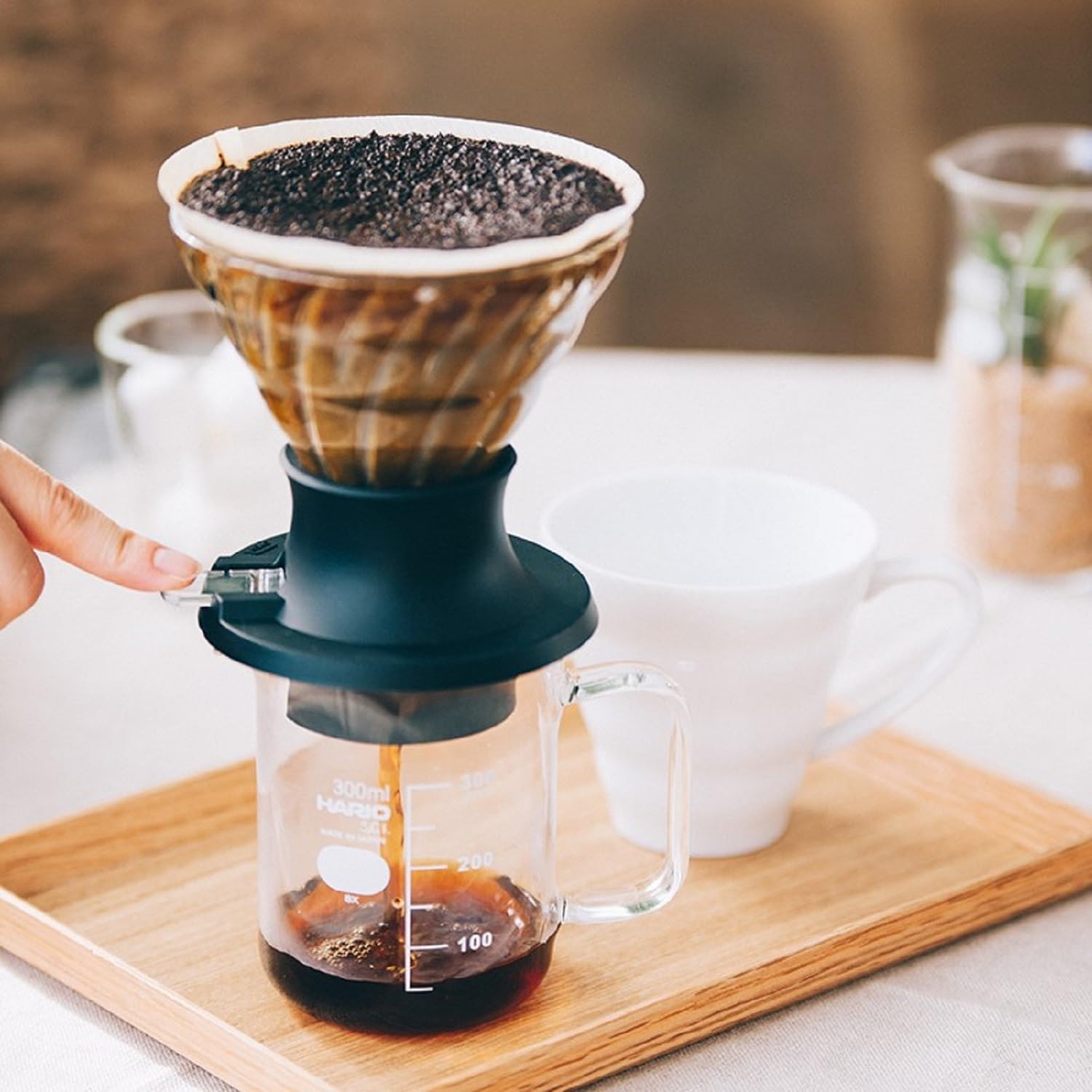HARIO Switch in use with gooseneck kettle for controlled pour-over and immersion