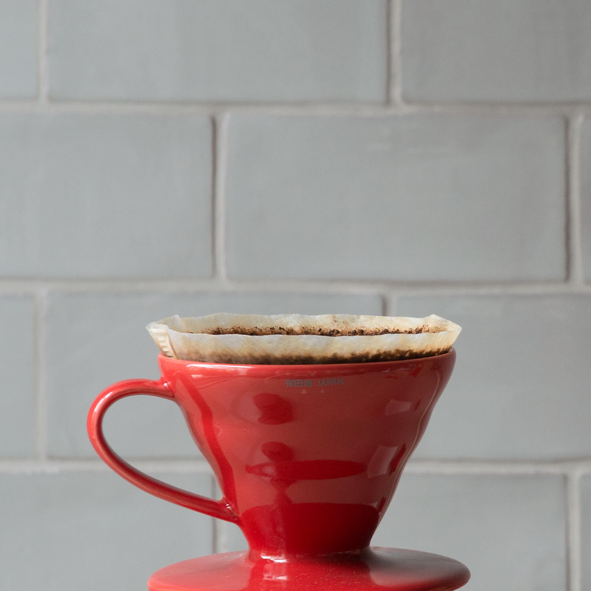 HARIO V60 placed on mug to show scale and compatibility for small-batch brewing