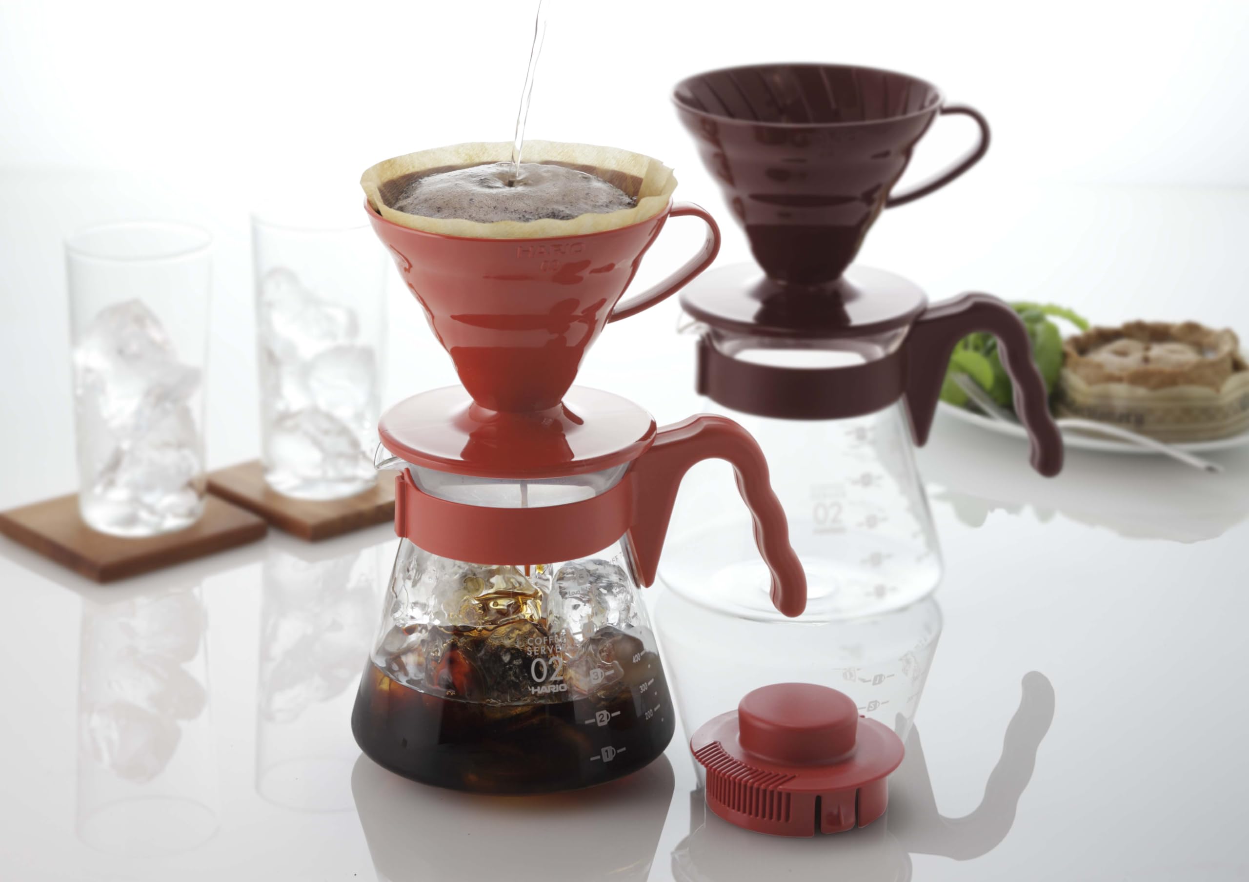 HARIO V60 dripper in use over server showing controlled pour and clear extraction
