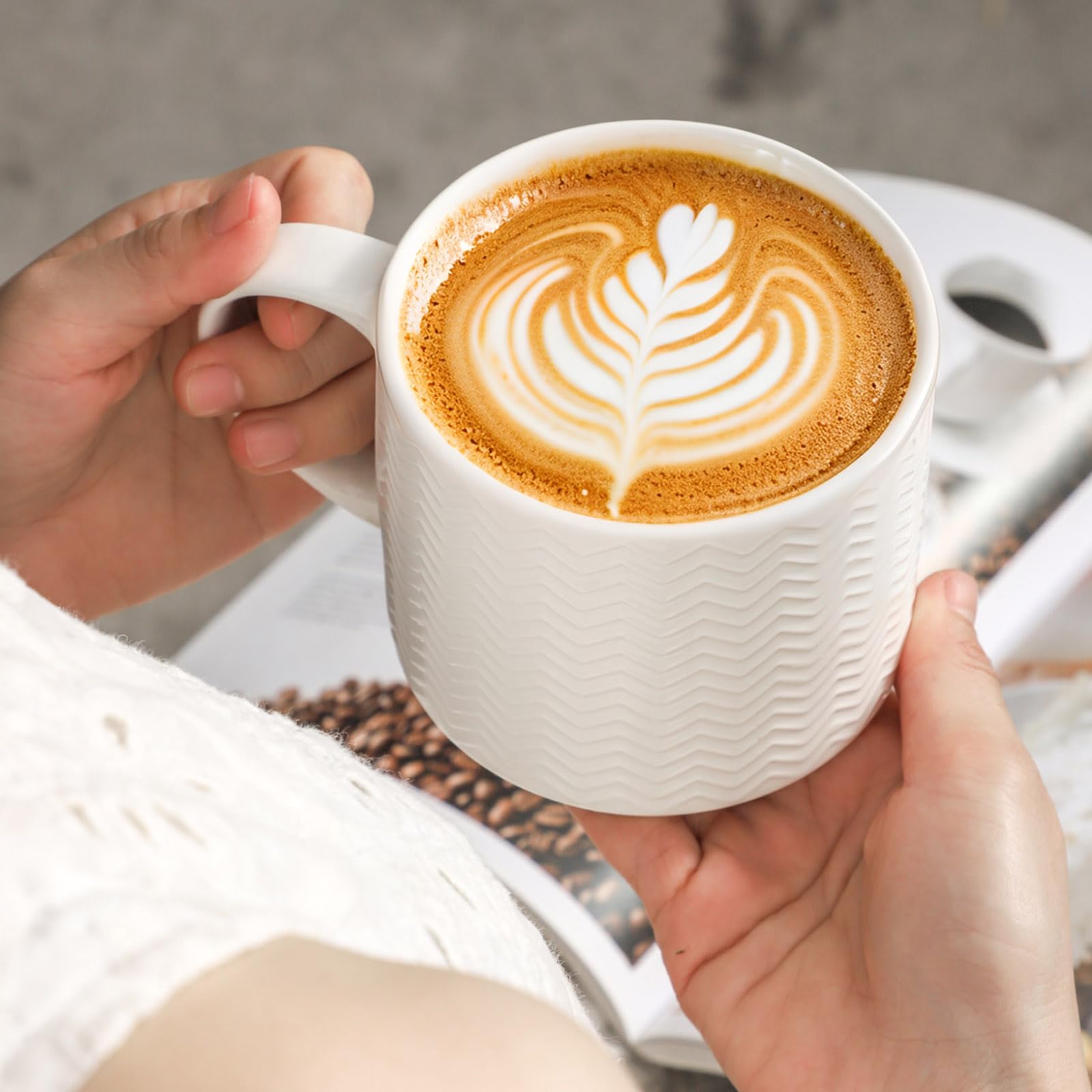 HASENSE mug in use with latte being poured demonstrating beverage suitability