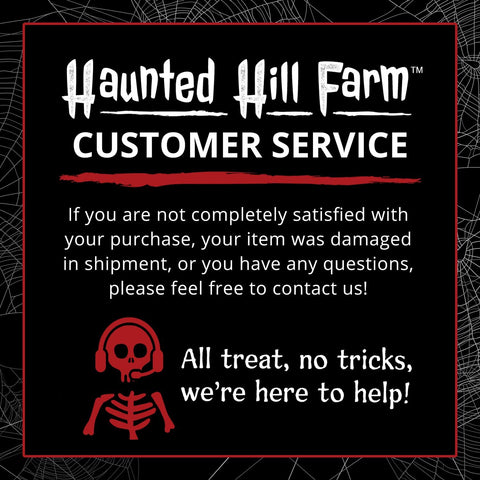 Haunted Hill Farm wreath beside door for scale showing ideal 22-inch fit