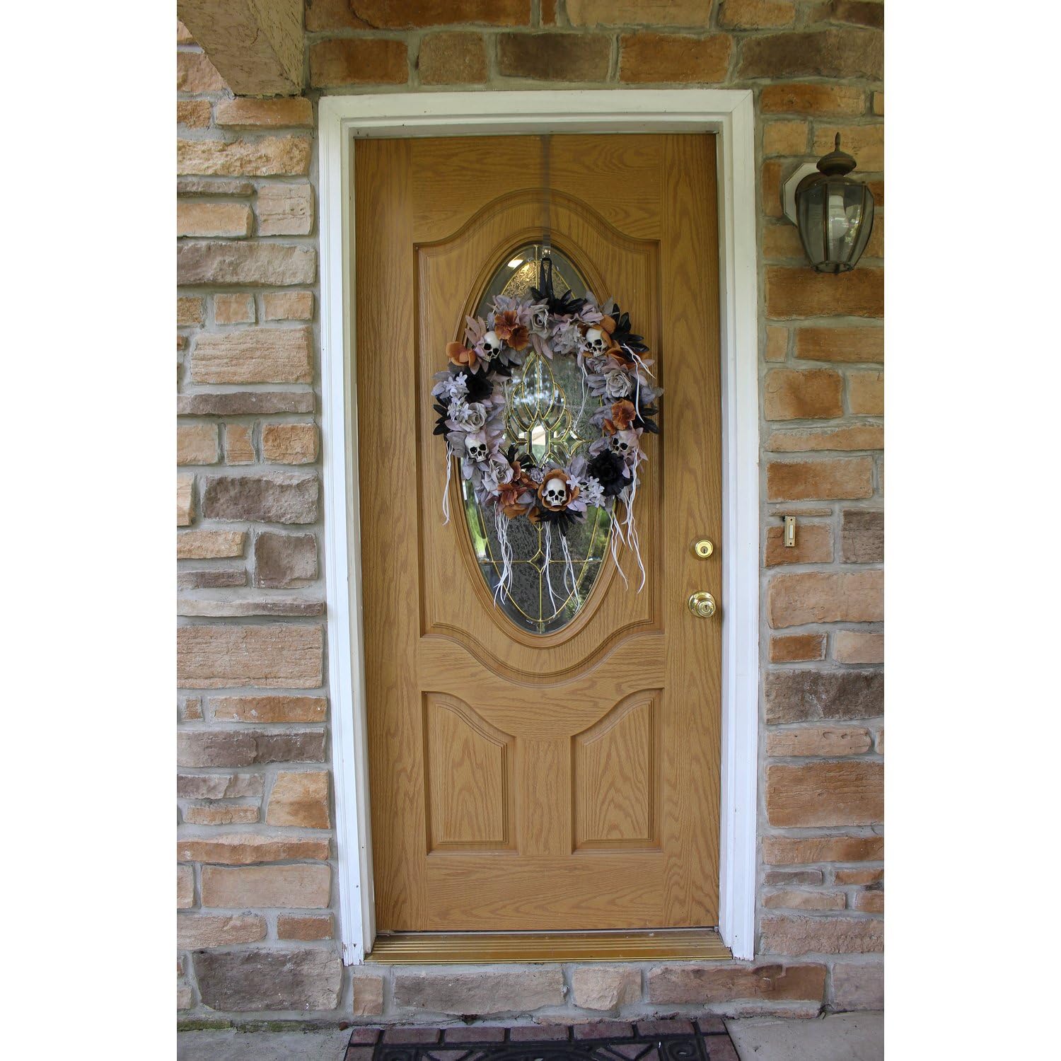 Haunted Hill Farm wreath on mantel illustrating indoor styling and moody atmosphere