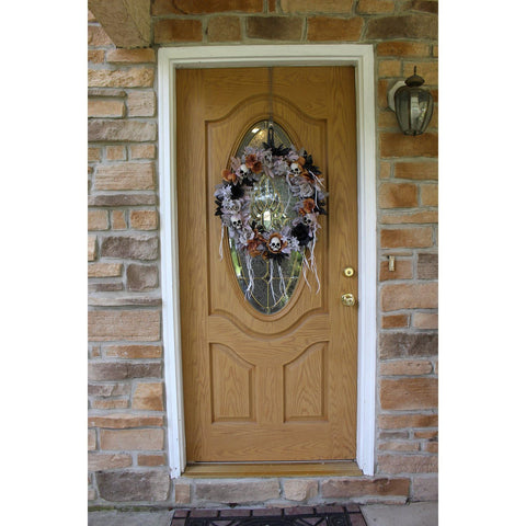 Haunted Hill Farm wreath on mantel illustrating indoor styling and moody atmosphere