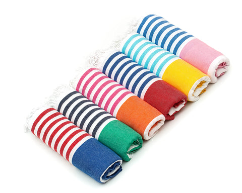 HAVLULAND folded towel set showing colors and compact packing benefit