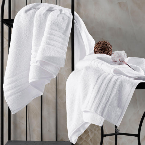 Hawmam Linen stitched edge and label close-up showing durable finish and easy-care guidance