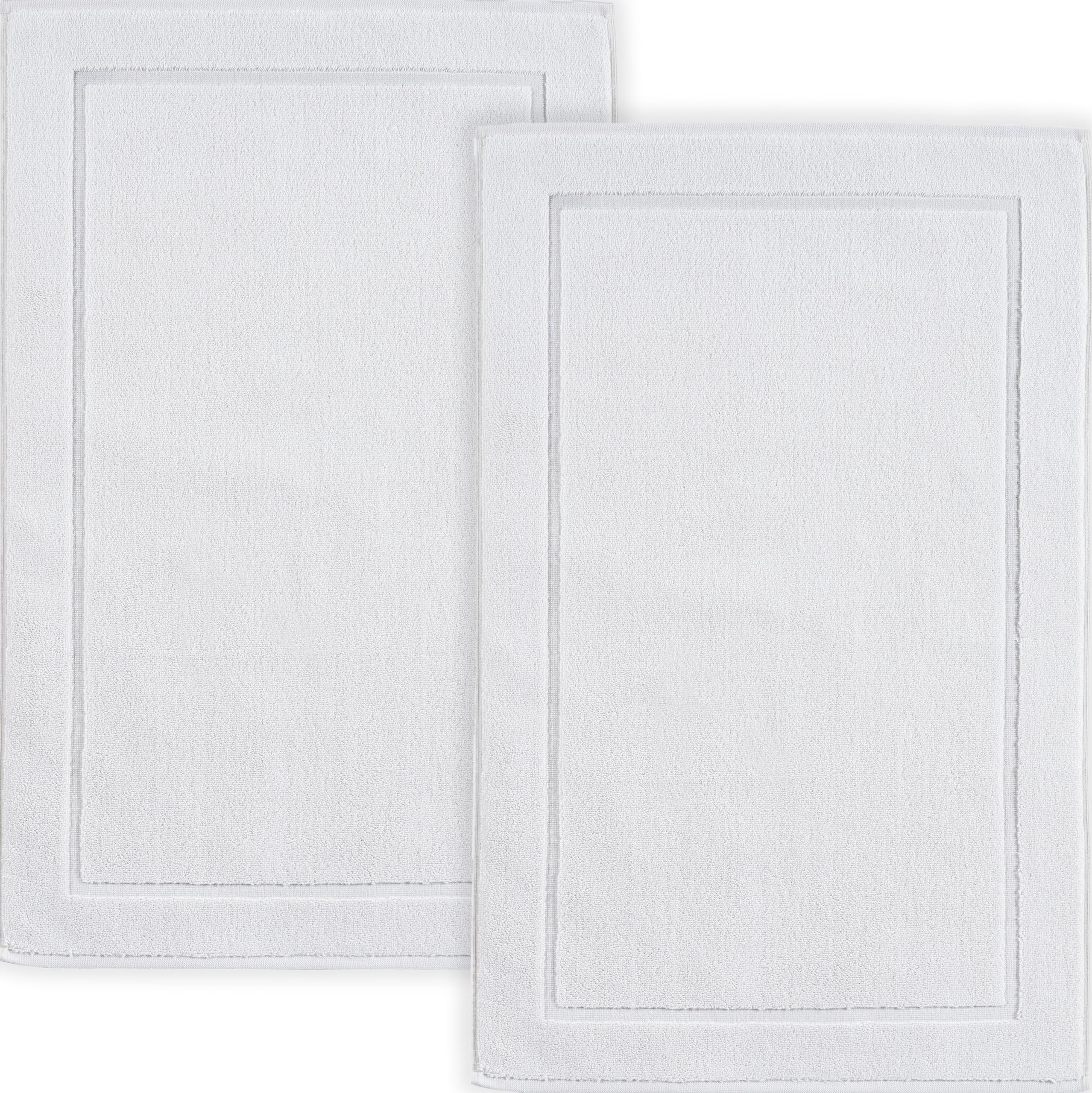 Hawmam Linen front view of two white bath mats showing banded design and clean look