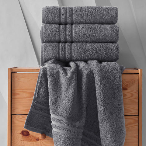 Hawmam towel next to mannequin illustrating 27x54 inch size useful for wrapping