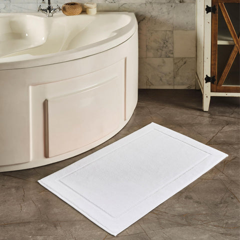 Hawmam Linen mat beside a ruler showing 21x34 inch scale for sizing clarity