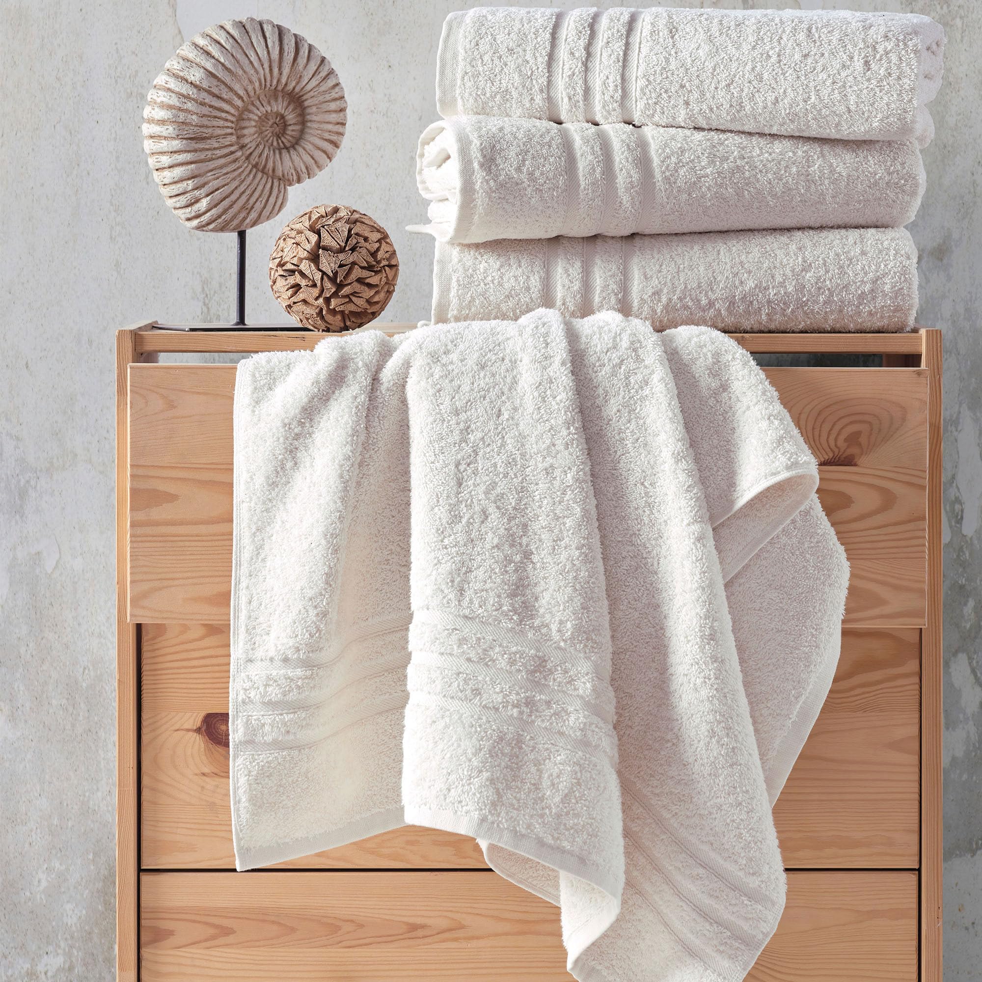 Hawmam Linen towel beside sink illustrating full 27x54 inch size and practical everyday use