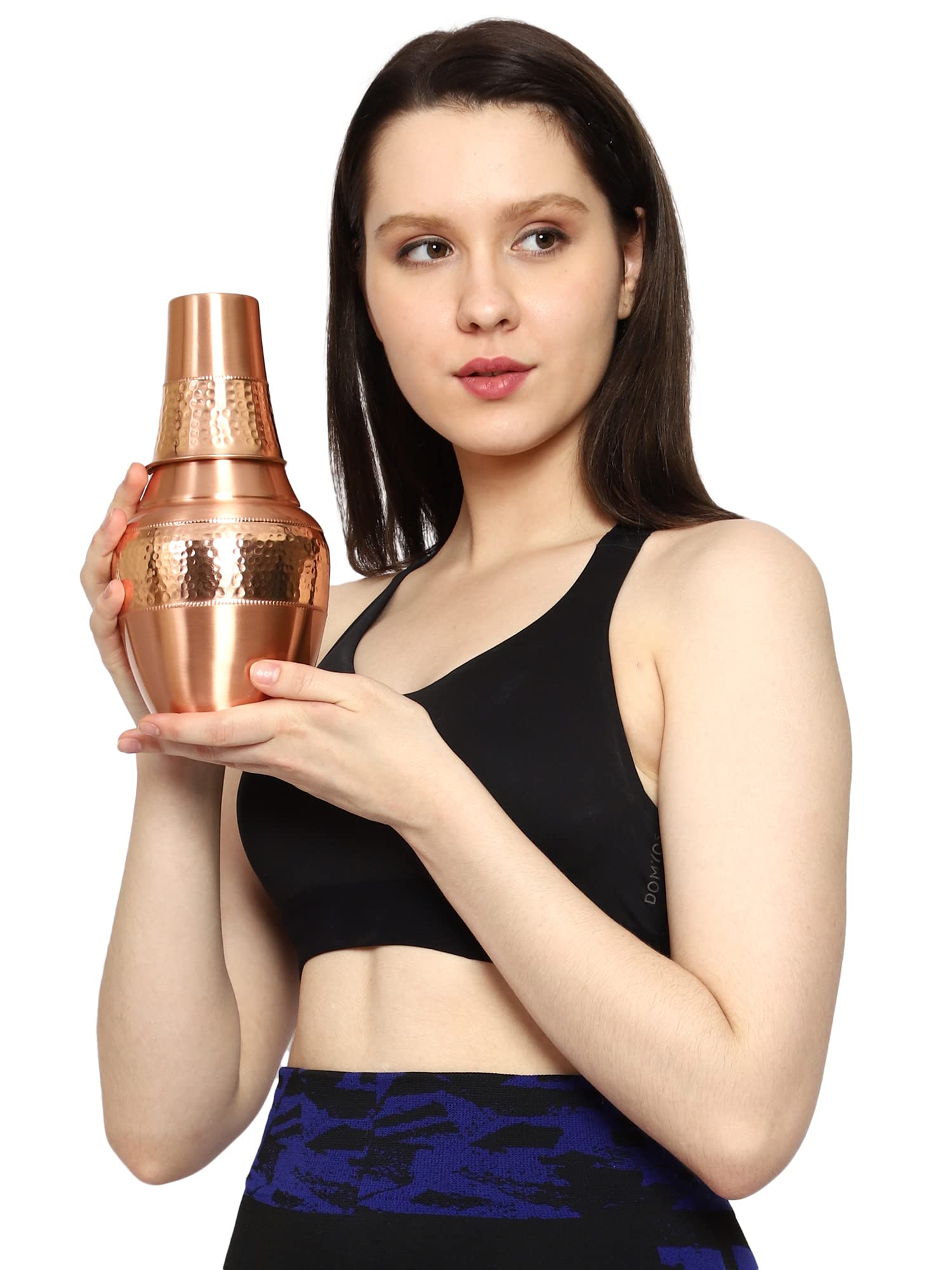 HealthGoodsIn carafe pouring water into tumbler showing spill-safe pour benefit
