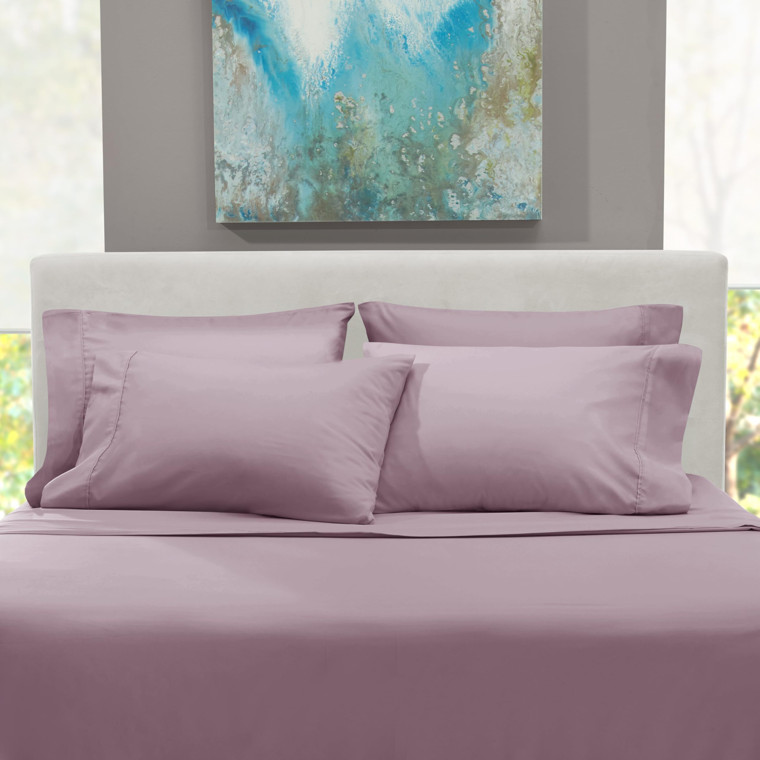 Hearth & Harbor styled bedroom with dusty purple sheets creating calm ambiance