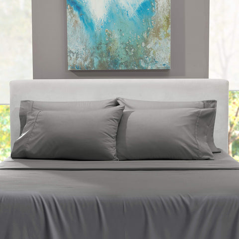 Hearth & Harbor styled bedroom with grey sheets showing modern, calming aesthetic
