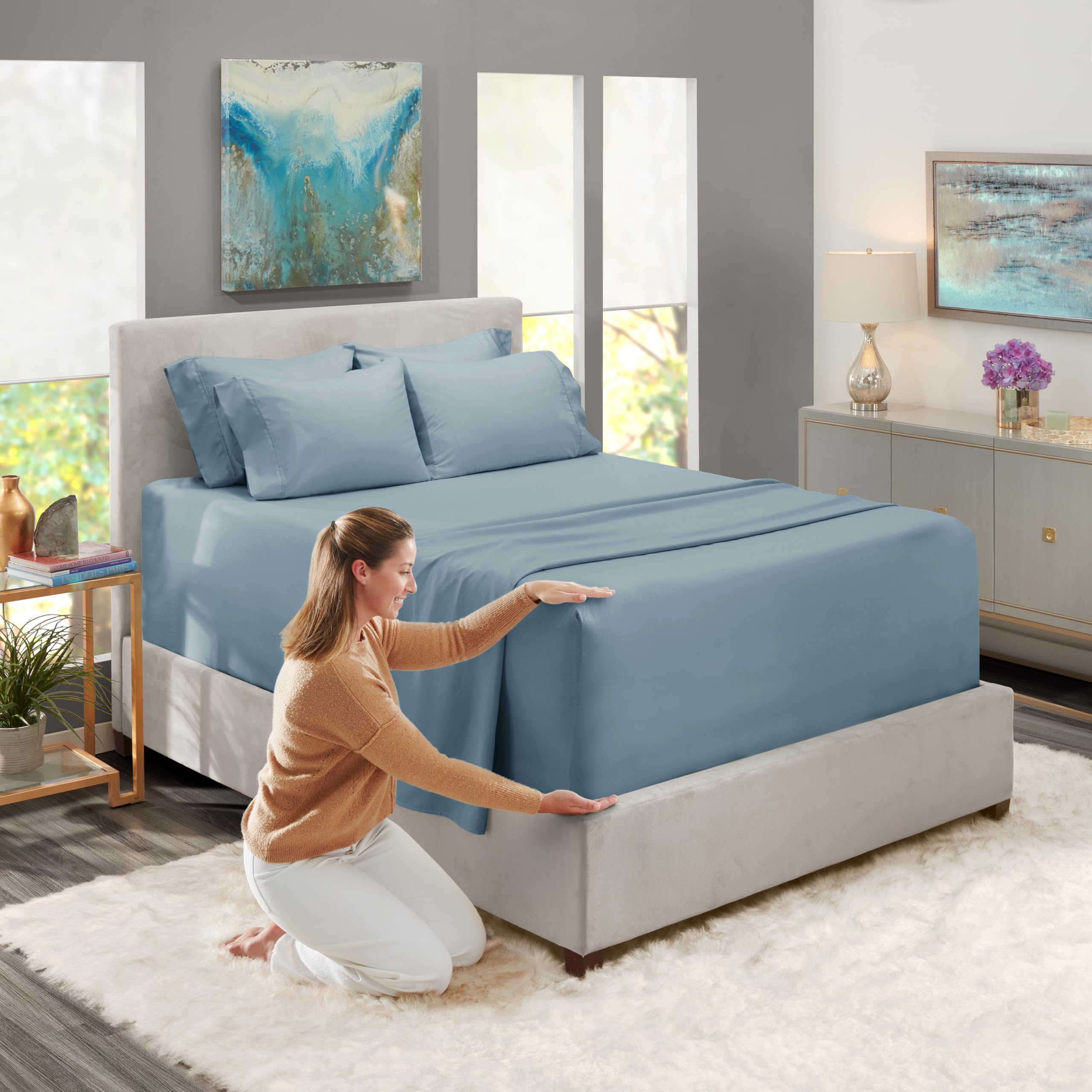Hearth & Harbor flat sheet spread over queen mattress showing full coverage and tuck-in benefit