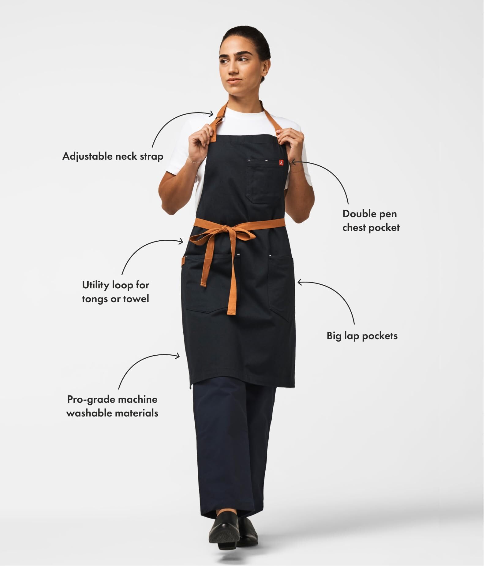 hedley & bennett oversized lap pocket close-up holding phone and recipe for easy access
