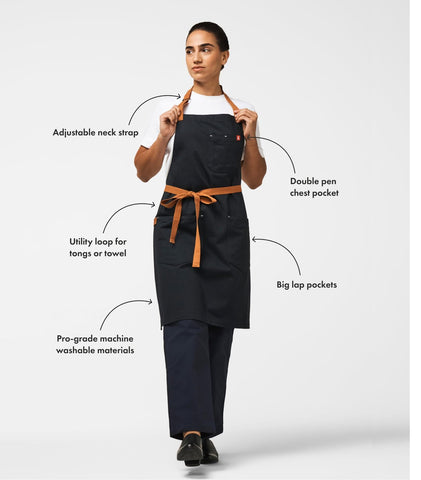 hedley & bennett oversized lap pocket close-up holding phone and recipe for easy access