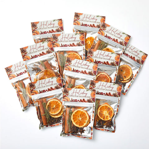 Heigble front packaging showing twelve Christmas potpourri sachets and holiday labeling, inviting cozy scent