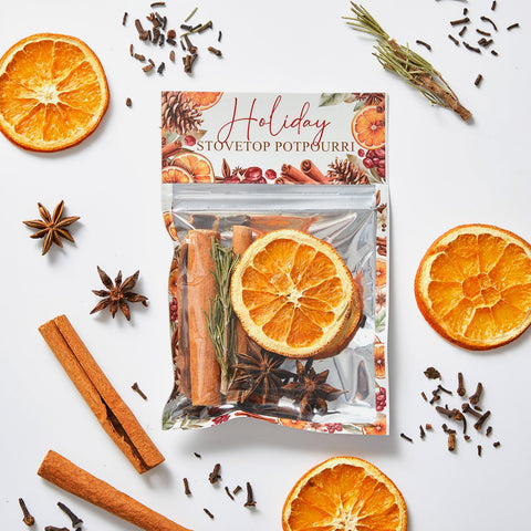 Heigble simmer pot in use on a kitchen stovetop releasing steam and warm holiday aroma for rooms
