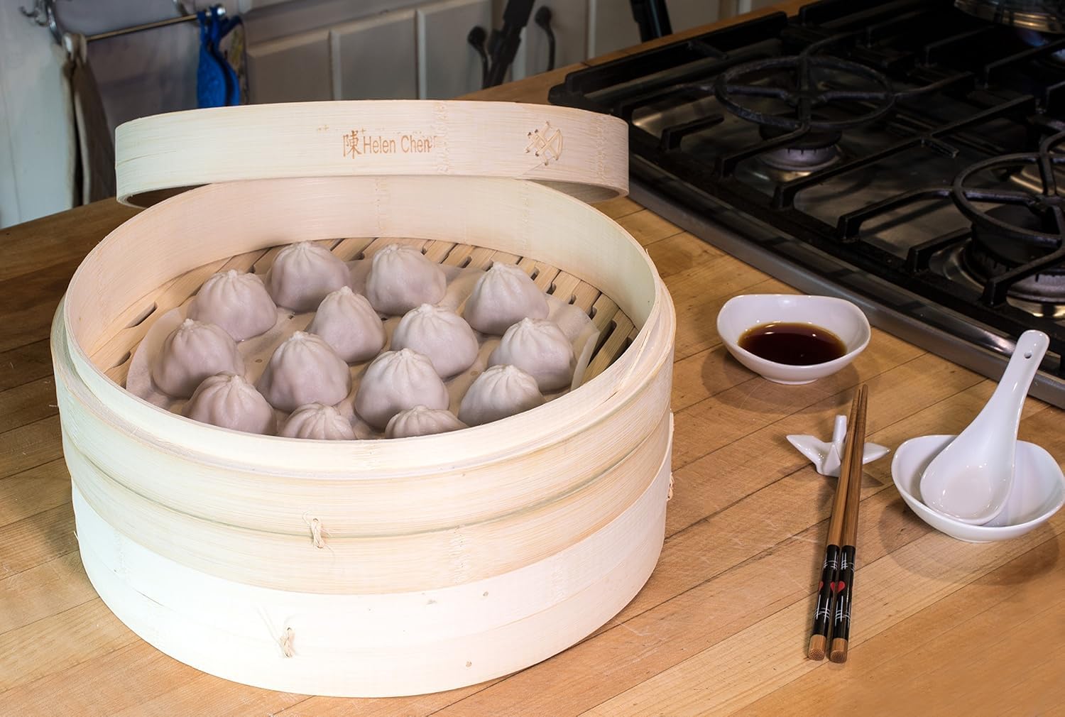 Helen's Asian Kitchen steamer filled with dumplings showing gentle cooking and presentation