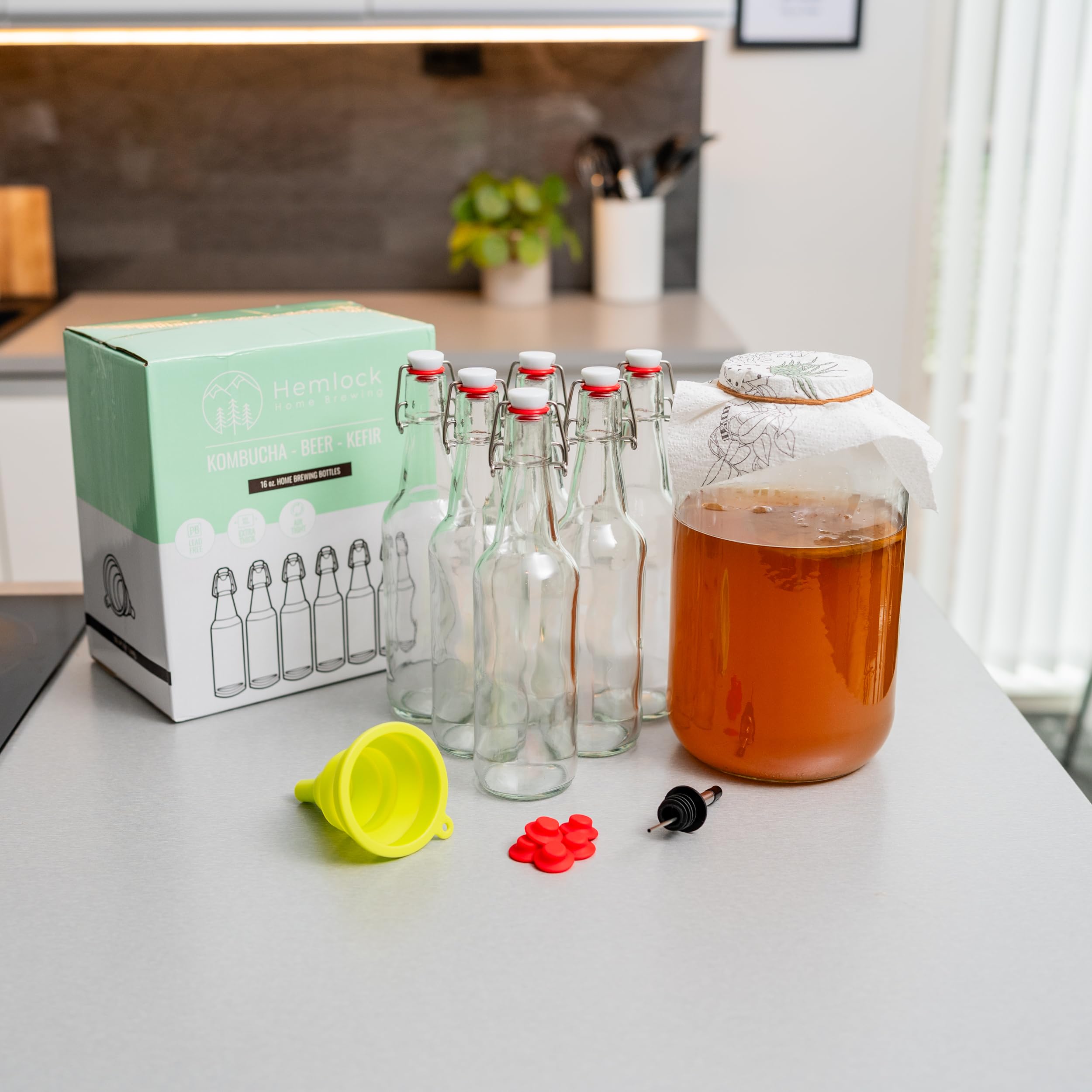 Hemlock Home Brewing lifestyle scene serving kombucha from bottle, attractive presentation
