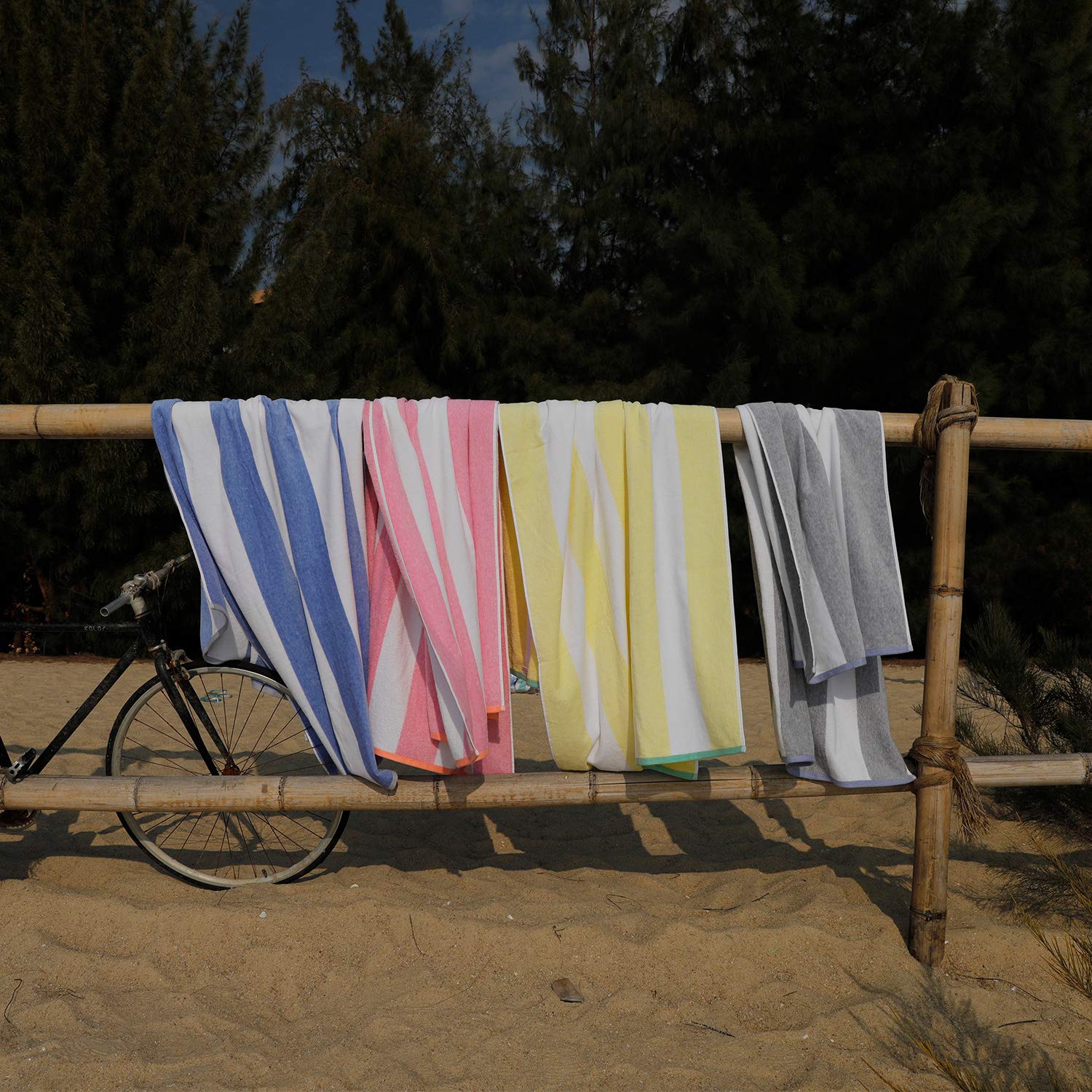 HENBAY folded towel next to water bottle showing compact storage benefit