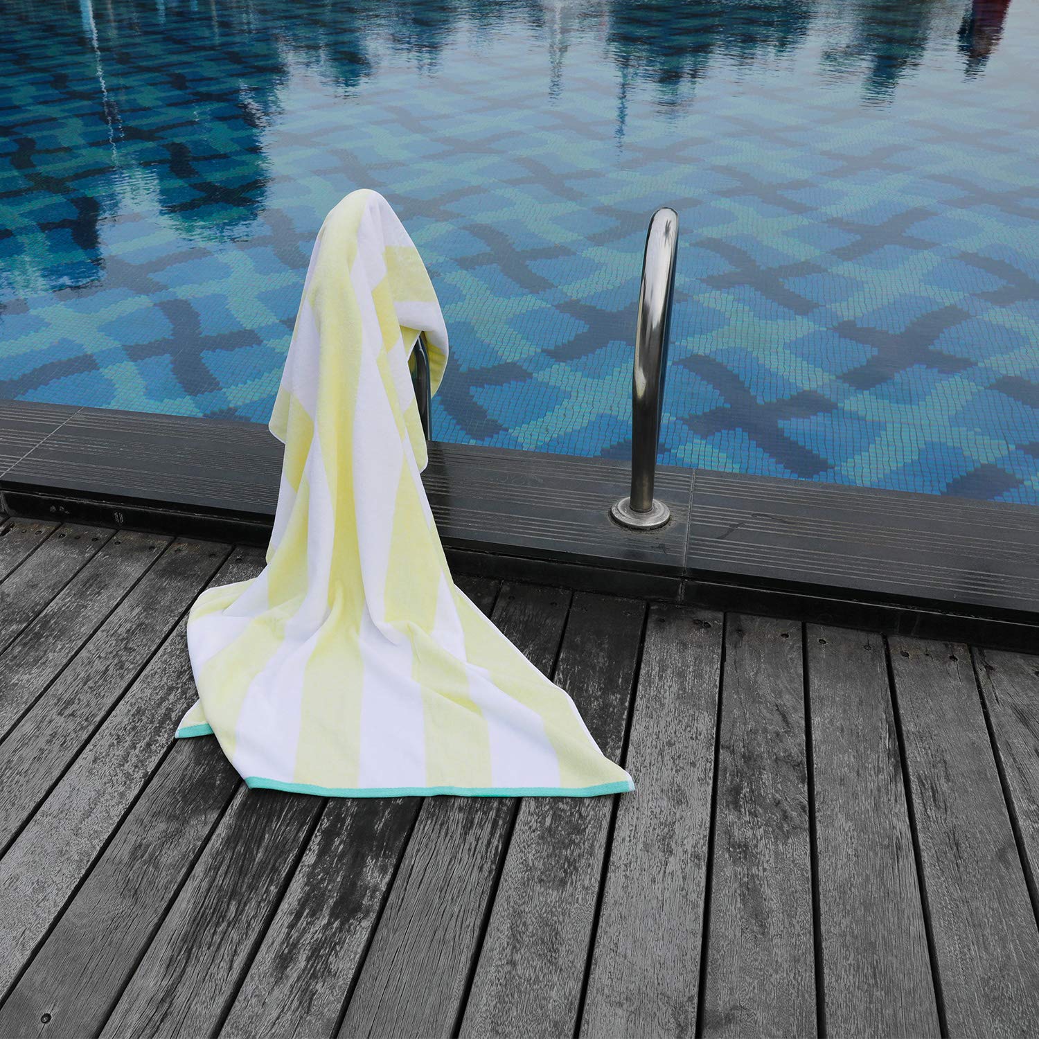 HENBAY towel draped on a pool chaise demonstrating large coverage and comfort