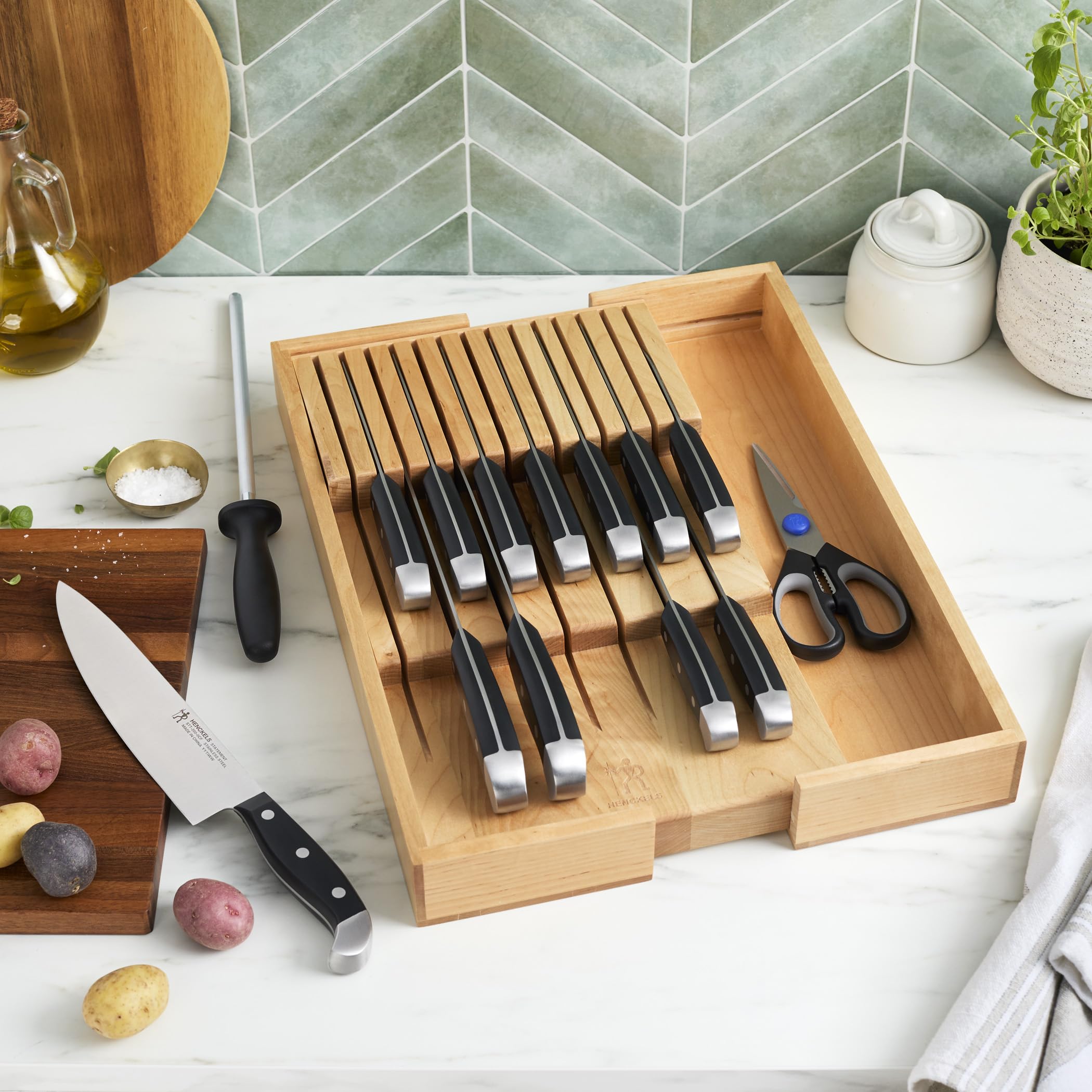 Henckels kitchen shears and sharpening steel displayed for maintenance and prep