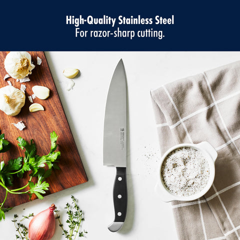 Henckels bread knife slicing a sourdough loaf for clean, even cuts