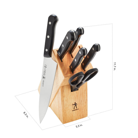 HENCKELS chef's knife slicing vegetables on cutting board demonstrating precision and control