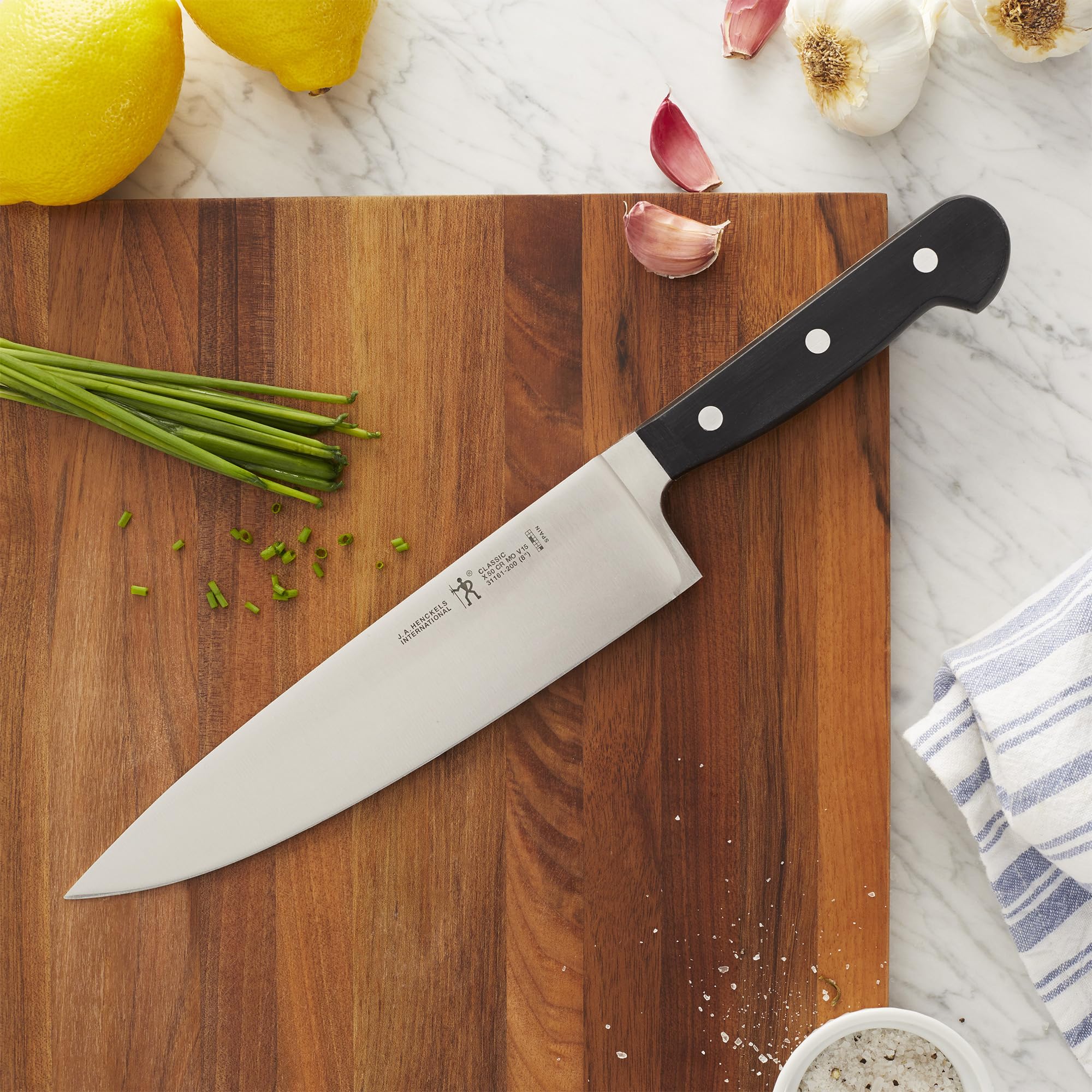 HENCKELS Classic blade close-up showing satin finish and sharp edge for precise slicing