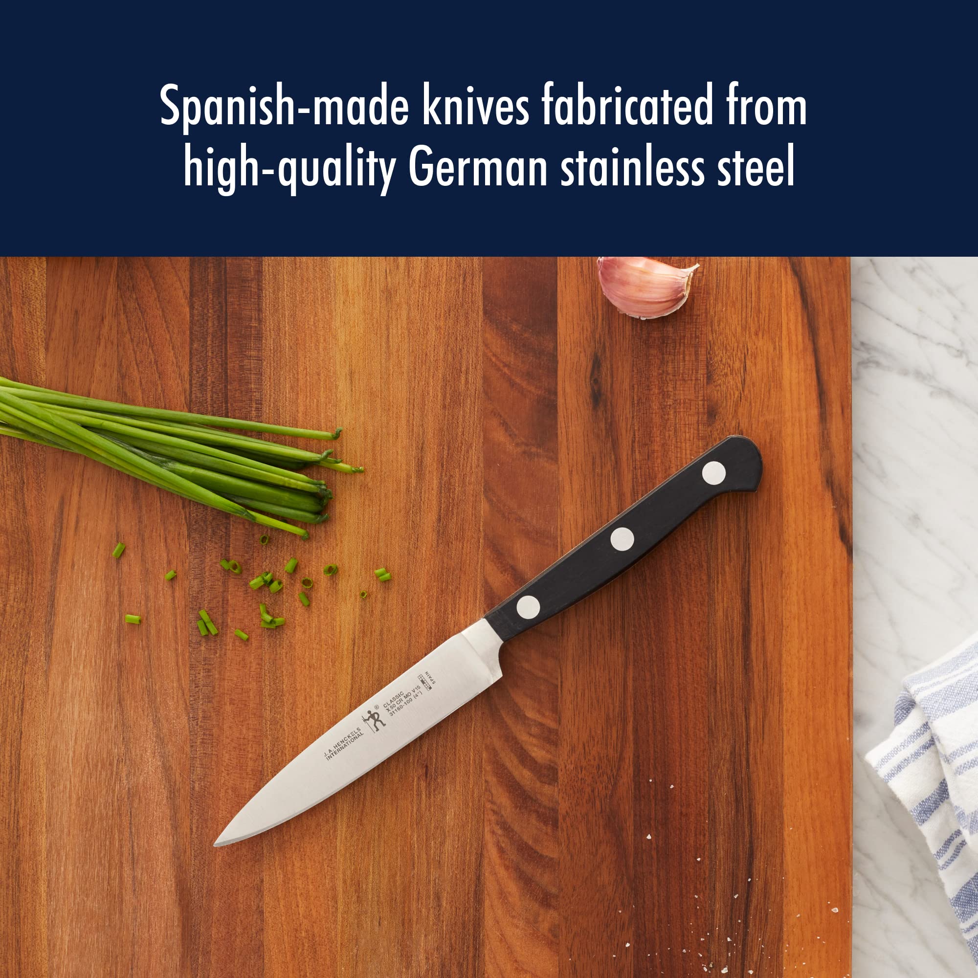 HENCKELS handle detail demonstrating ergonomic grip and balanced control