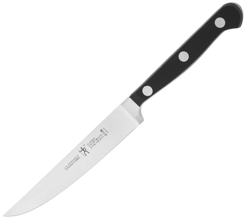 HENCKELS knife slicing cooked steak in hand showing smooth cuts and reduced effort