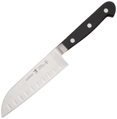 HENCKELS Classic beside a hand for scale demonstrating compact size and comfortable grip