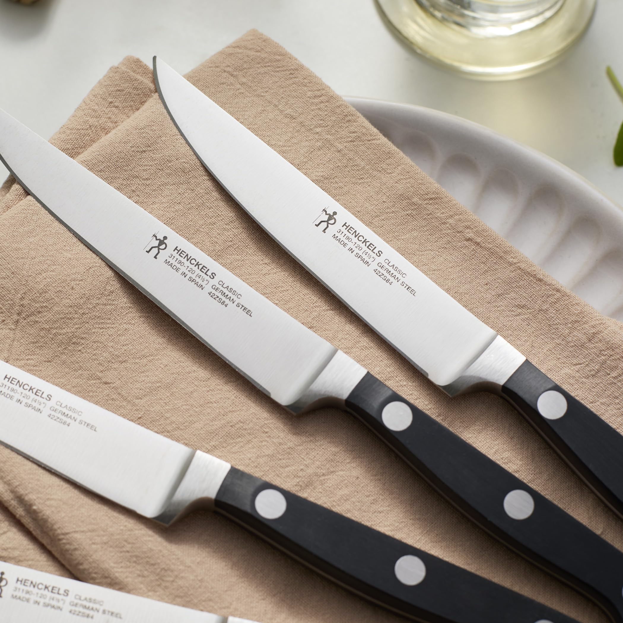 HENCKELS knives beside ruler for size and scale reference showing convenient table use