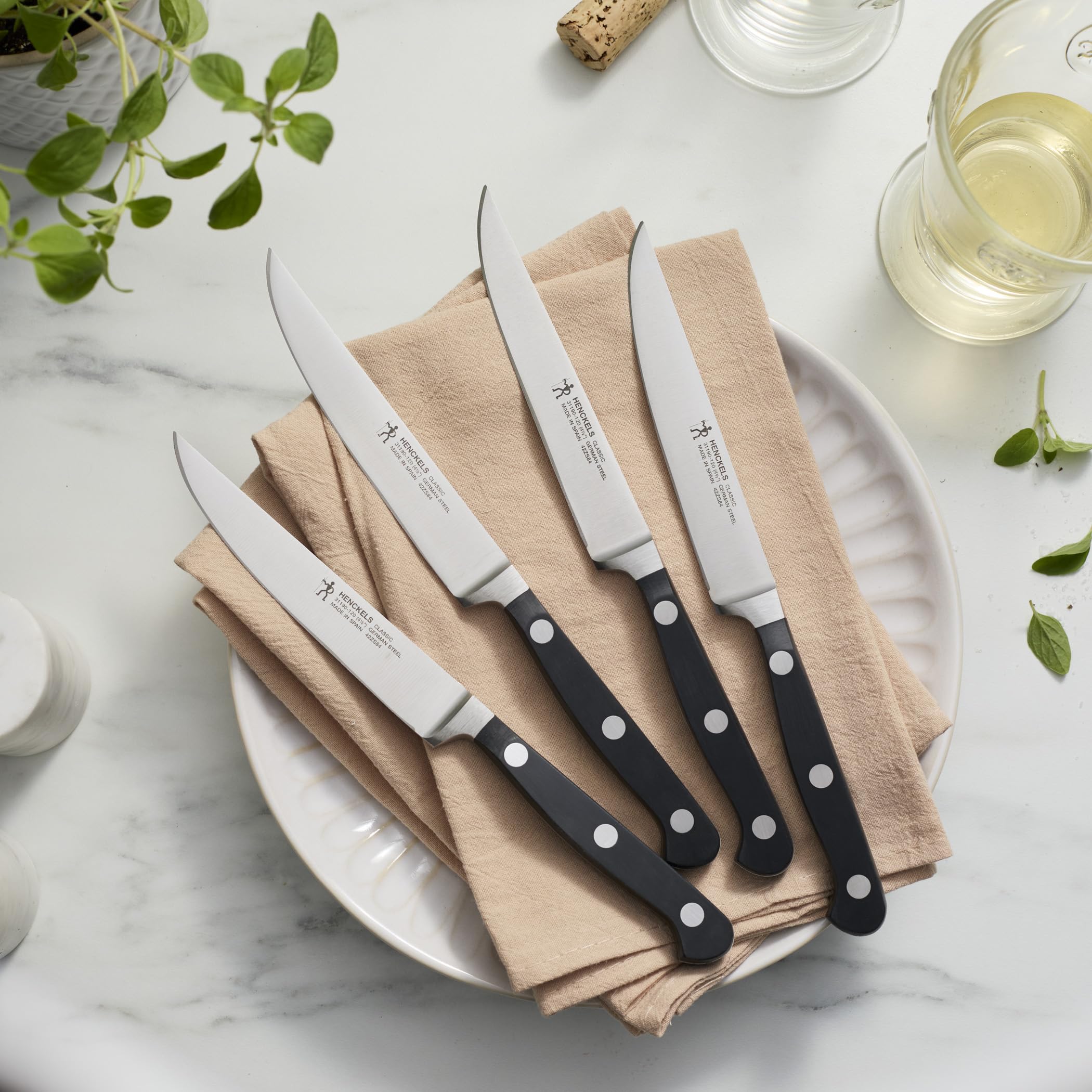 HENCKELS blade closeup with satin finish highlighting razor-sharp edge for effortless slicing