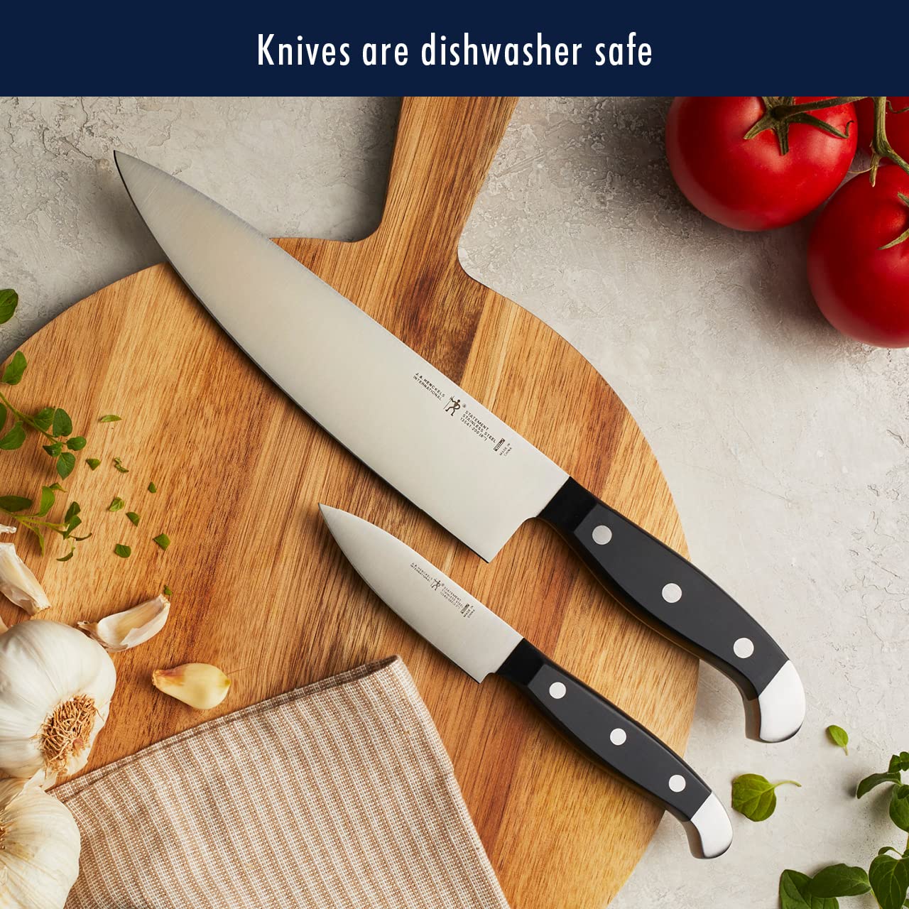 HENCKELS handle close-up showing triple-rivet comfort and ergonomic balance
