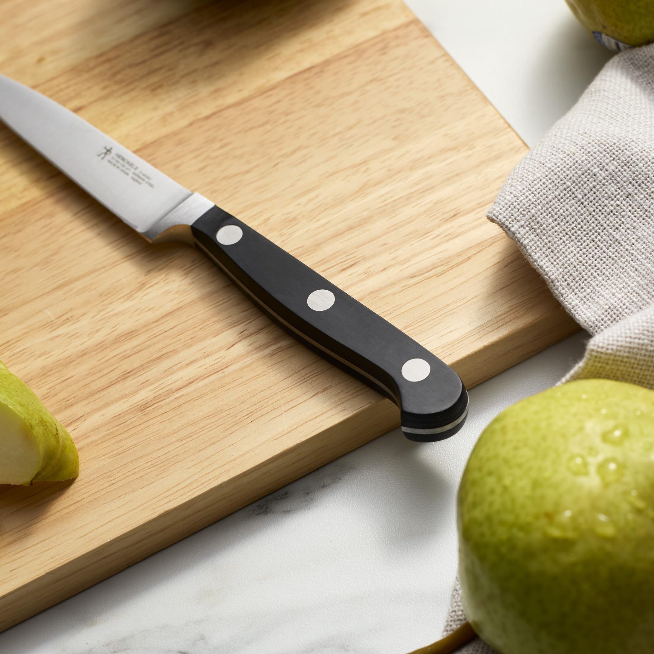 HENCKELS paring on cutting board showing blade angle and stability