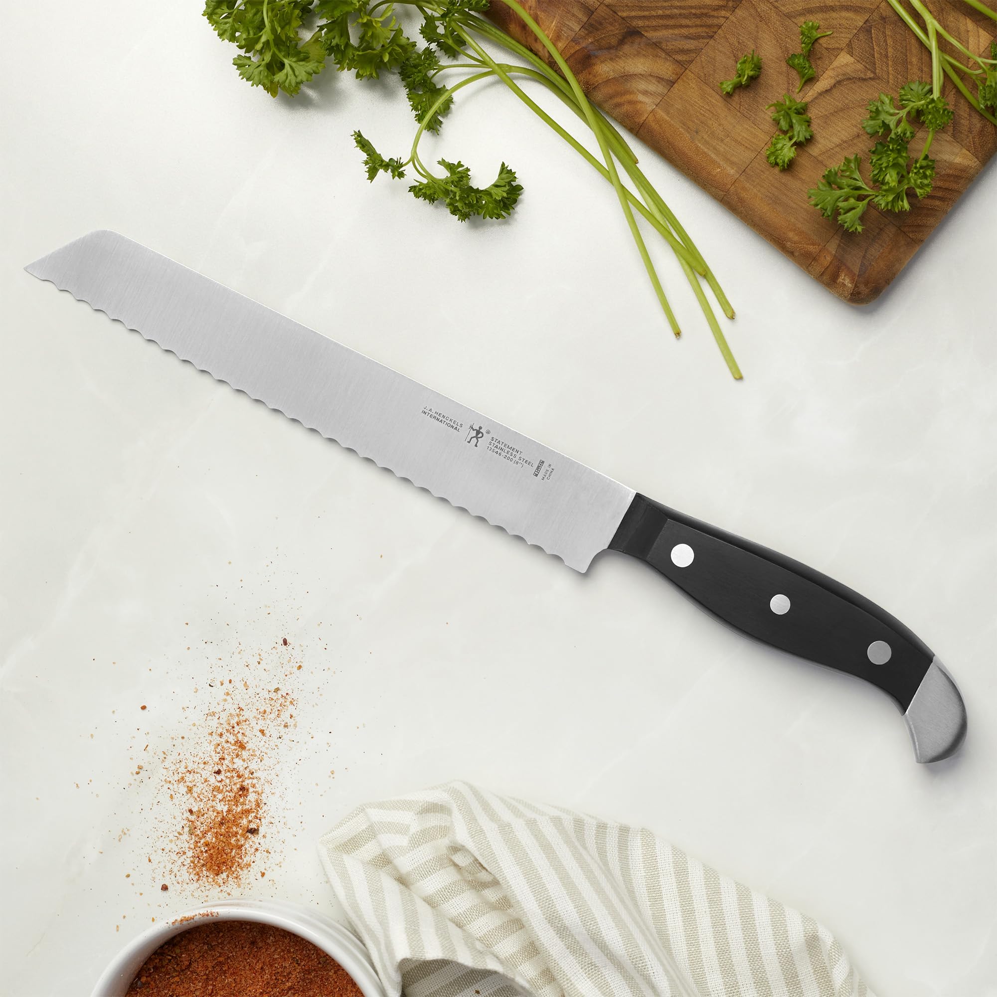 HENCKELS Statement close-up of serrated blade teeth highlighting sharpness and precision
