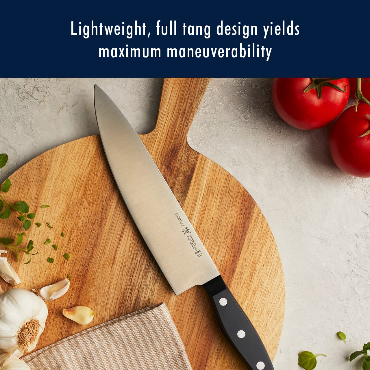 HENCKELS triple-rivet handle close-up showing ergonomic curve for comfortable grip benefit