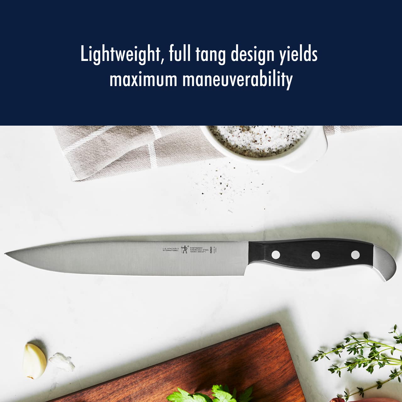 HENCKELS kitchen shears and boning knife shown for trimming and utility tasks