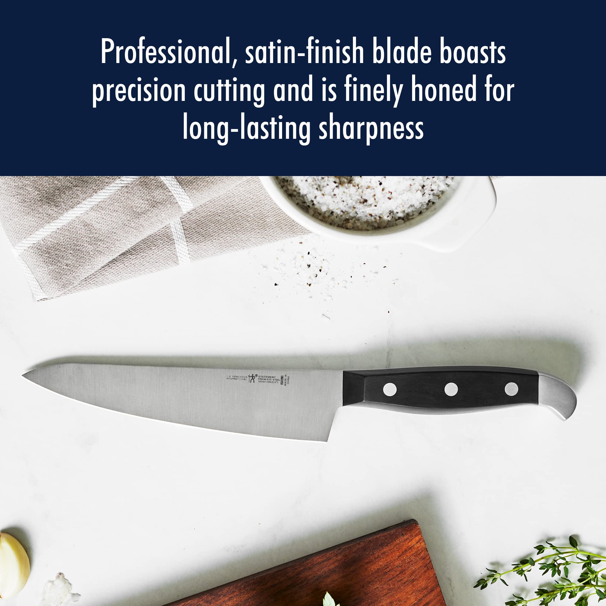 HENCKELS knife held in hand for size comparison showing lightweight maneuverability