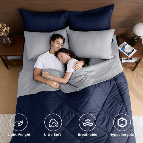 HEVUMYI comforter laid on bed in navy blue and grey, showcasing finished look and comfort