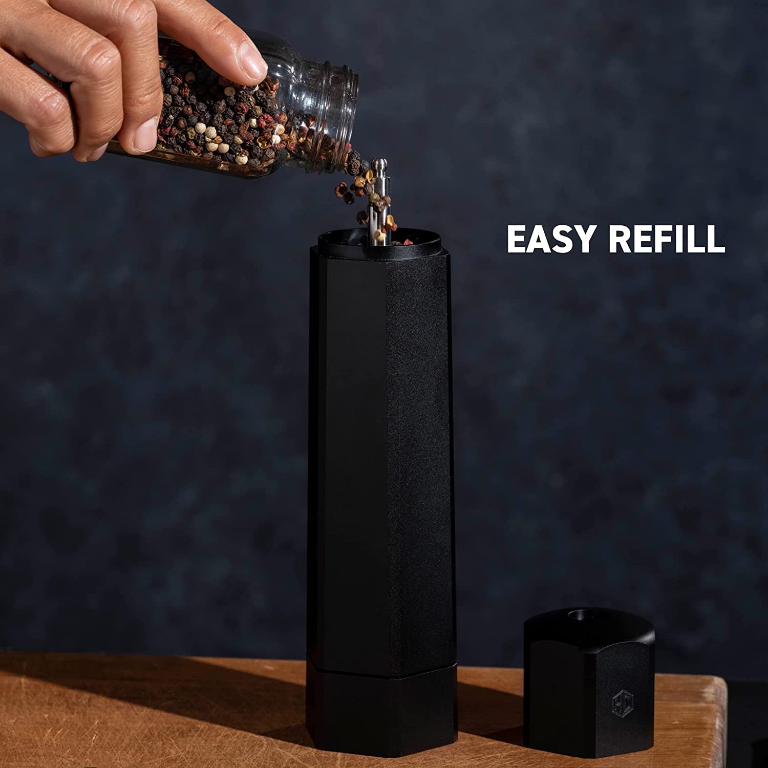 HexClad HexMill held in hand to show scale and comfortable grip for fast grinding