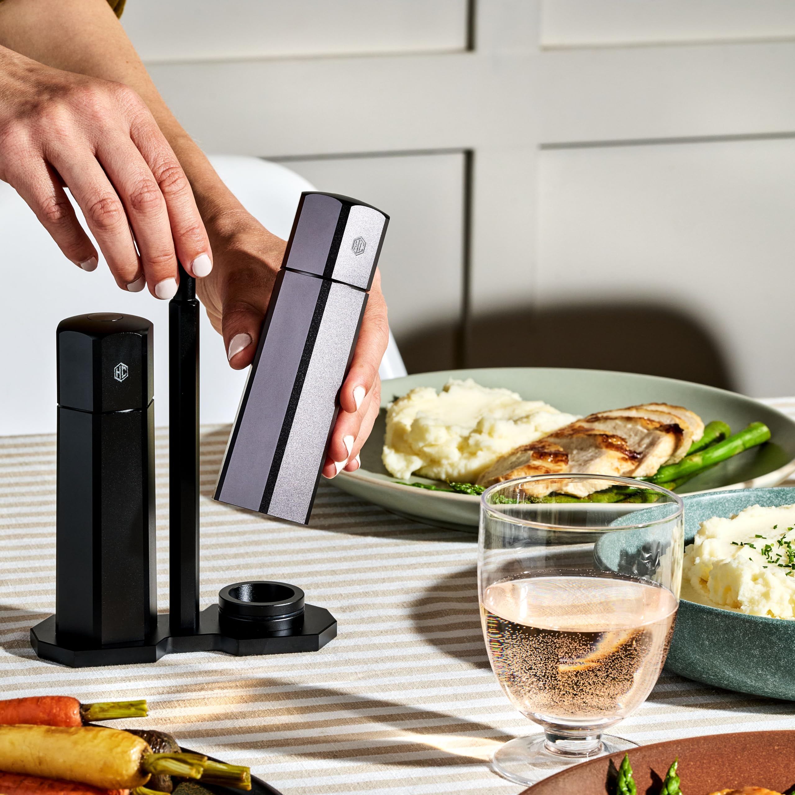 HexClad HexMill on dining table seasoning food to improve meal presentation